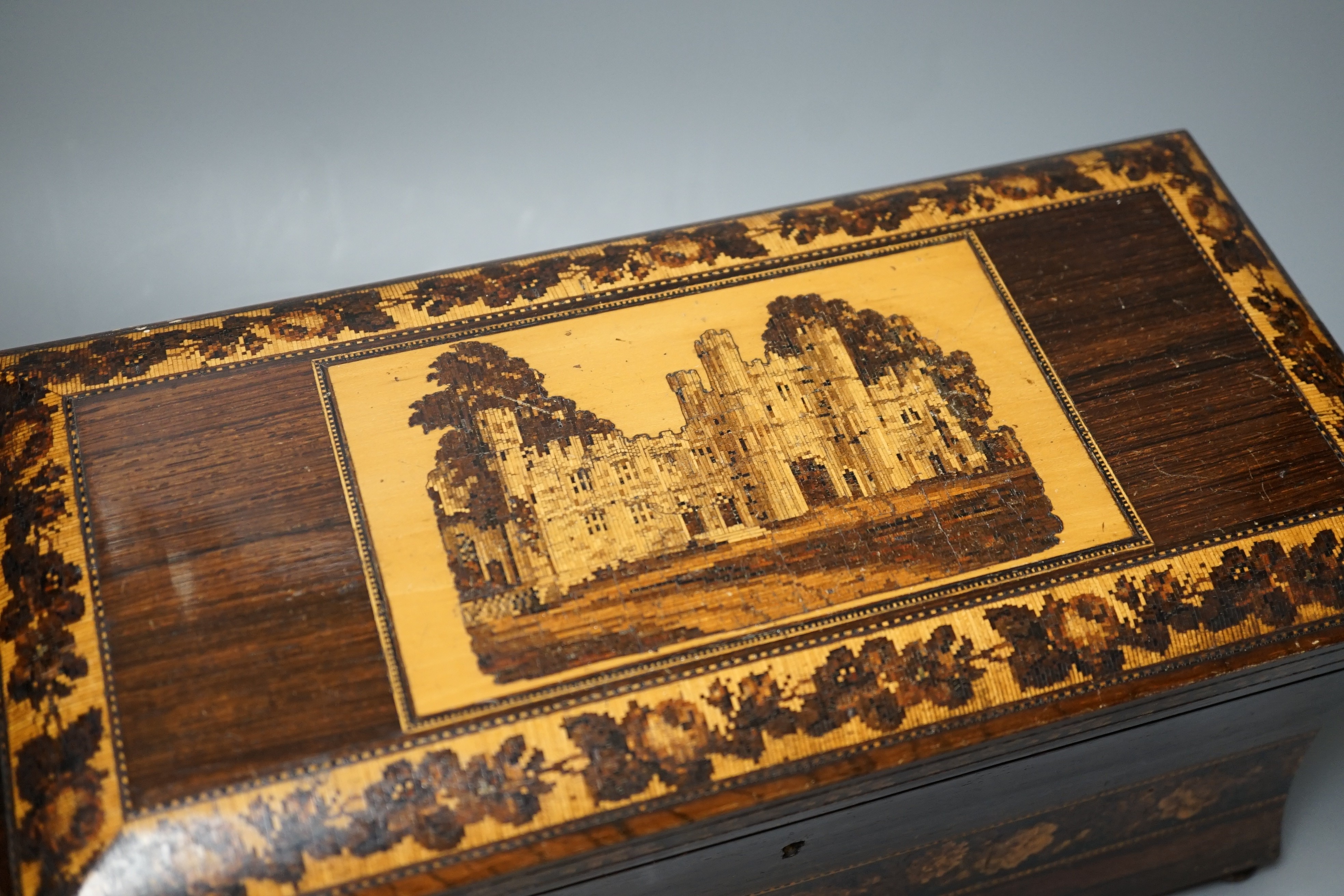 A late 19th century Tunbridge ware tea caddy depicting Eridge Castle, 31cm wide